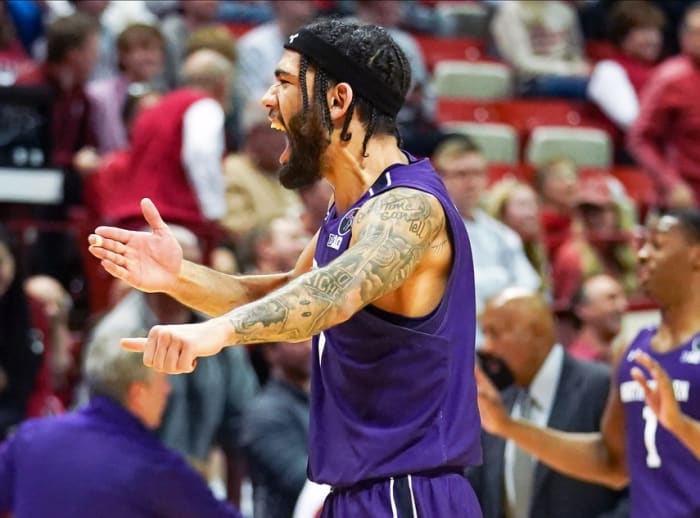Northwestern Wildcats guard Boo Buie (0) celebrates after defeating the Indiana Hoosiers at Simon Skjodt Assembly Hall.